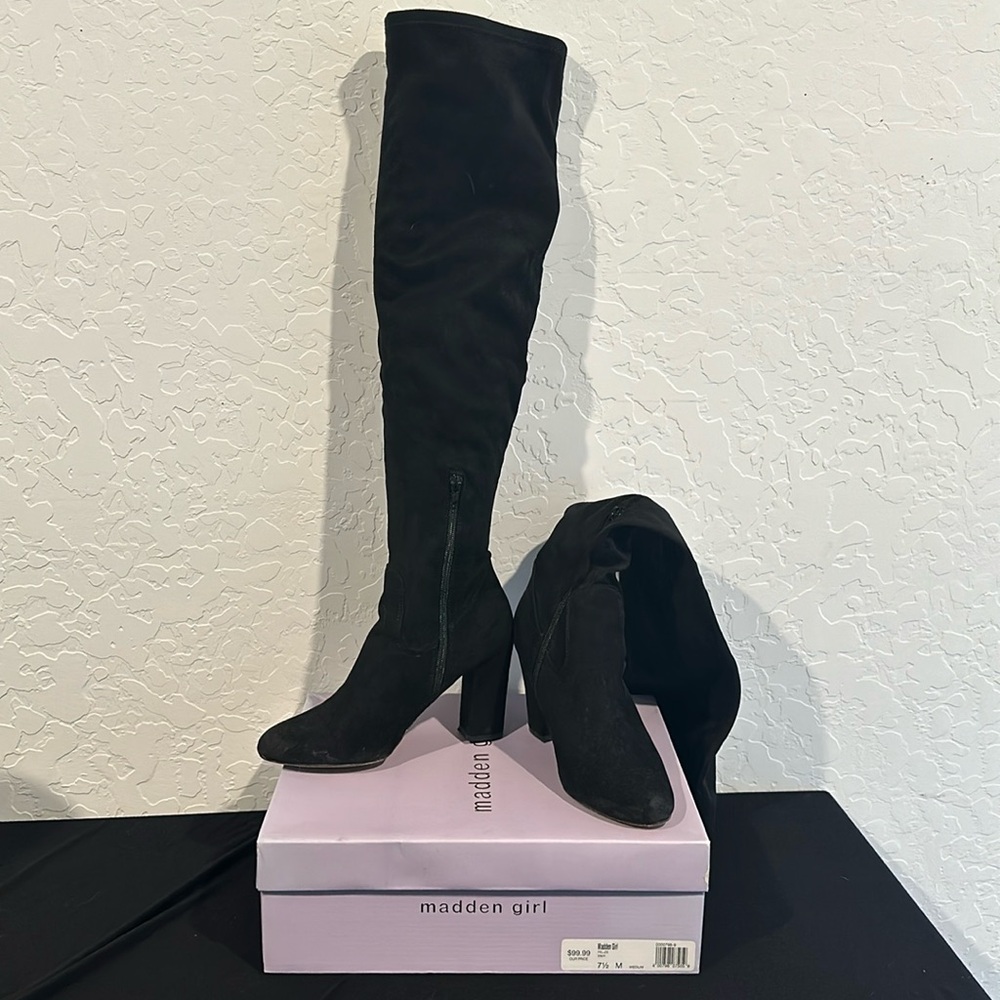 Black over knee heeled boots.